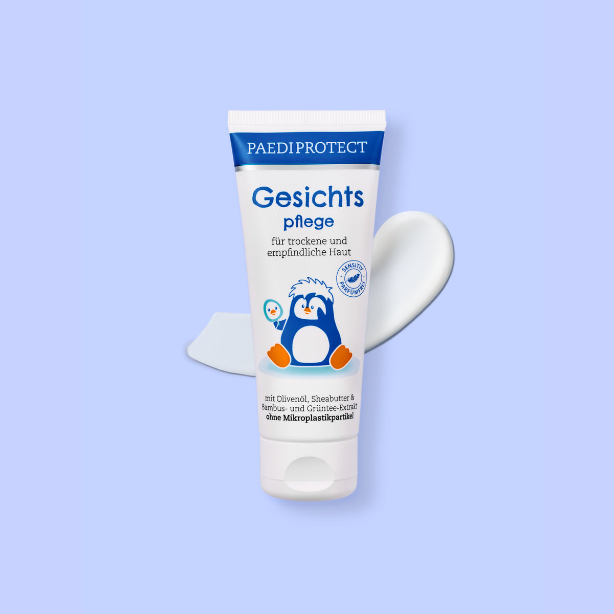PAEDIPROTECT Gesichtspflege in der Tube, daneben ein Klecks Creme.