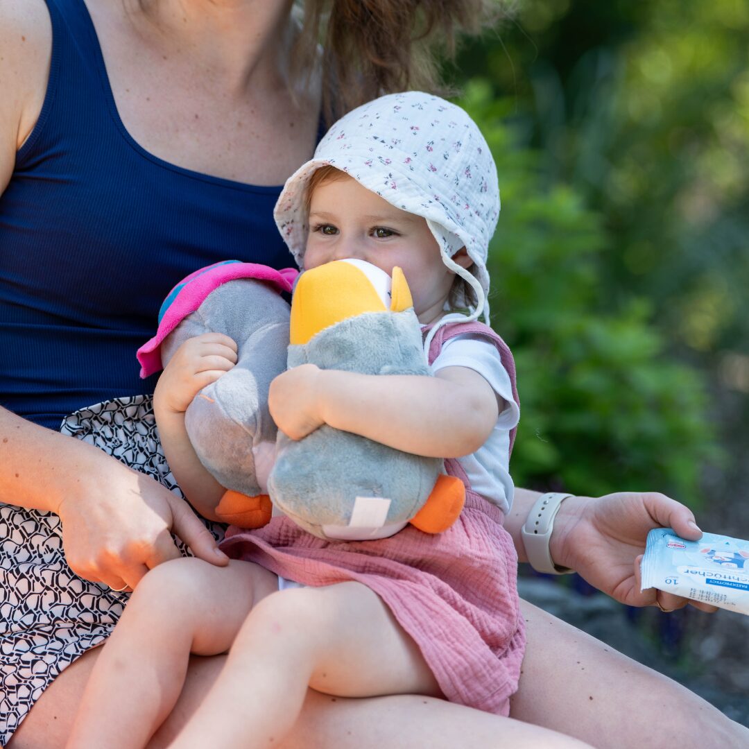 a woman holding a baby