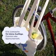 Jutebeutel am Fahrradlenker: für kleine Ausflüge, Picknick oder Sportunterricht.