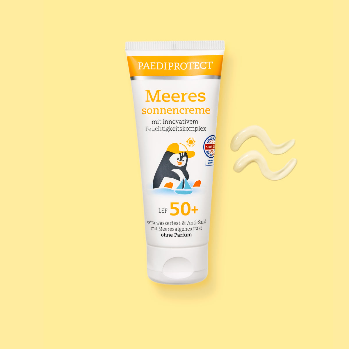 PAEDIPROTECT Meeressonnencreme LSF 50+ in der Tube, daneben ein Klecks Creme.