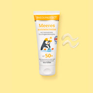 PAEDIPROTECT Meeressonnencreme LSF 50+ in der Tube, daneben ein Klecks Creme.