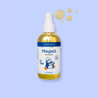 PAEDIPROTECT Pflegeöl in der Pumpflasche, daneben Öltropfen.