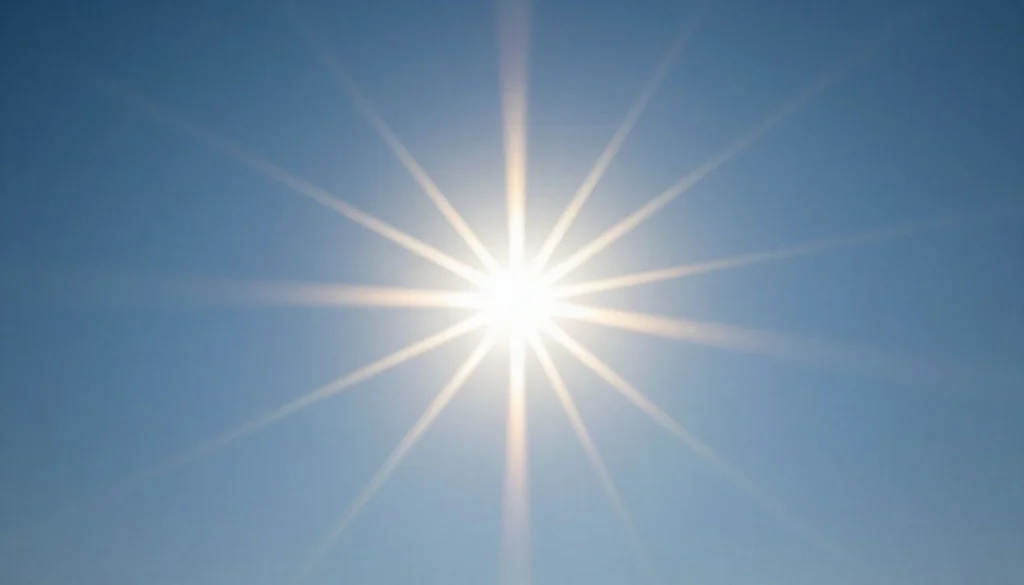 Sunbeams shining brightly in a clear blue sky.