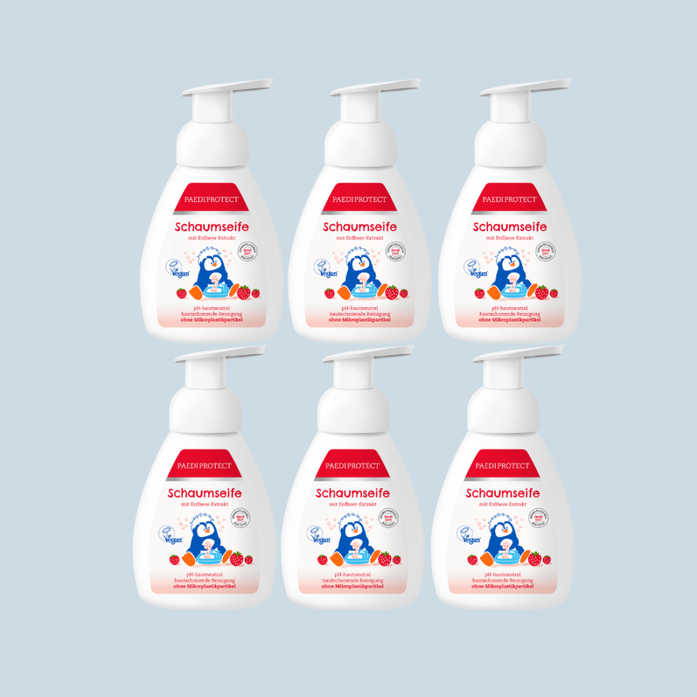 a group of plastic bottles with a red and white label