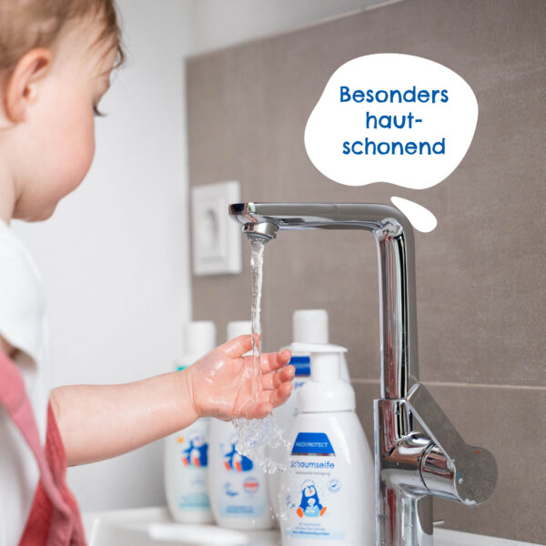 a white bottle with red label