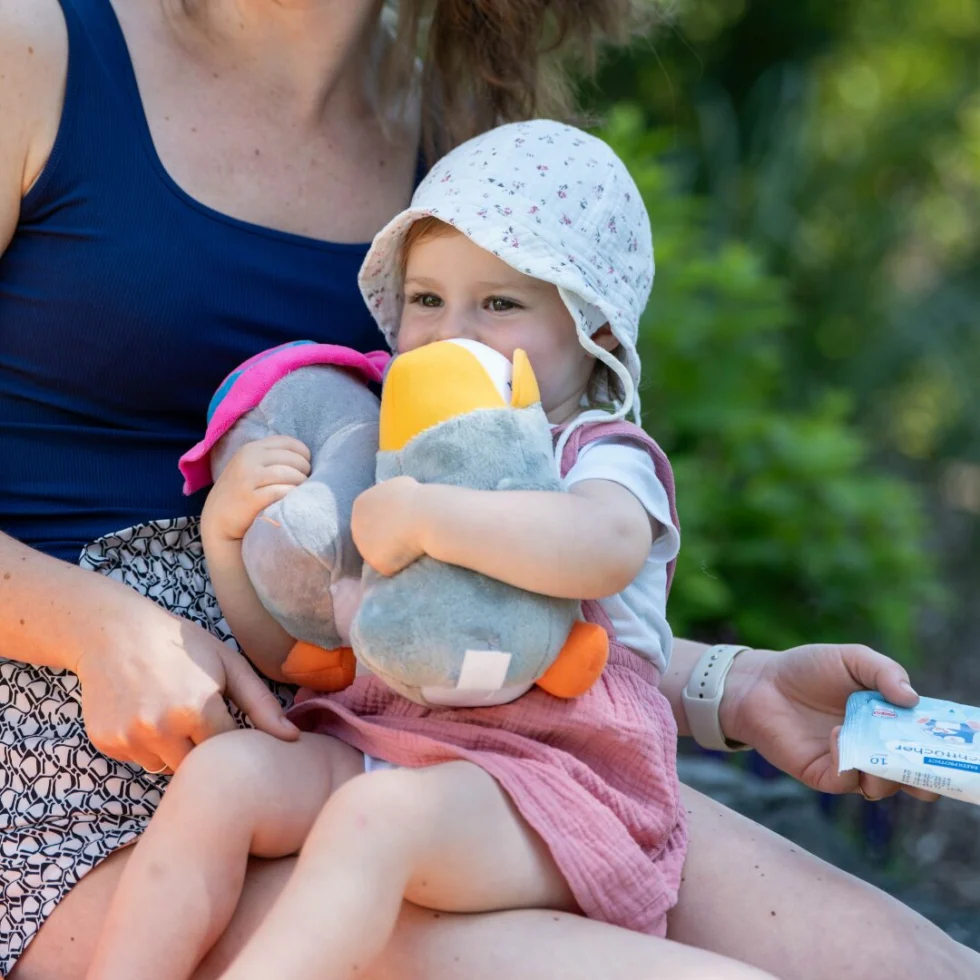 a woman holding a baby
