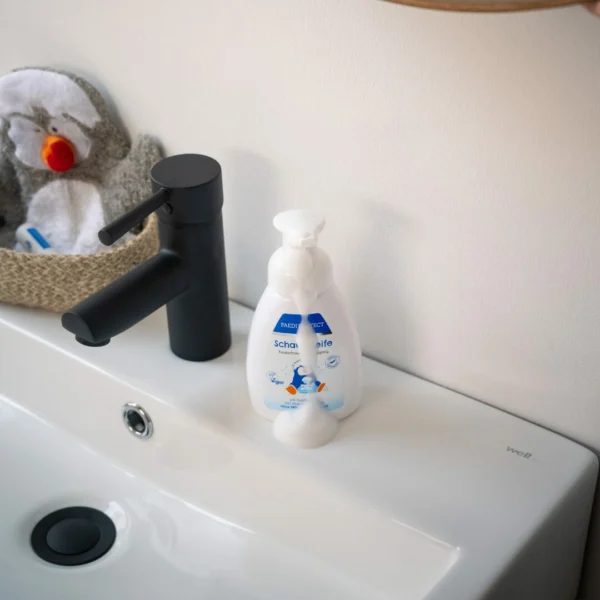a sink with a black faucet and a black faucet and a black sink with a black faucet and a black faucet and a black faucet with a white