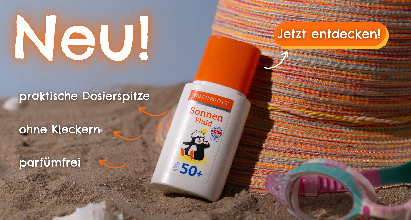 a bottle of sunblock on sand