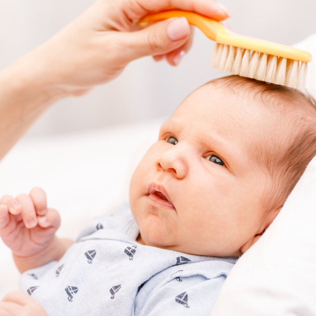 brushing baby hair
